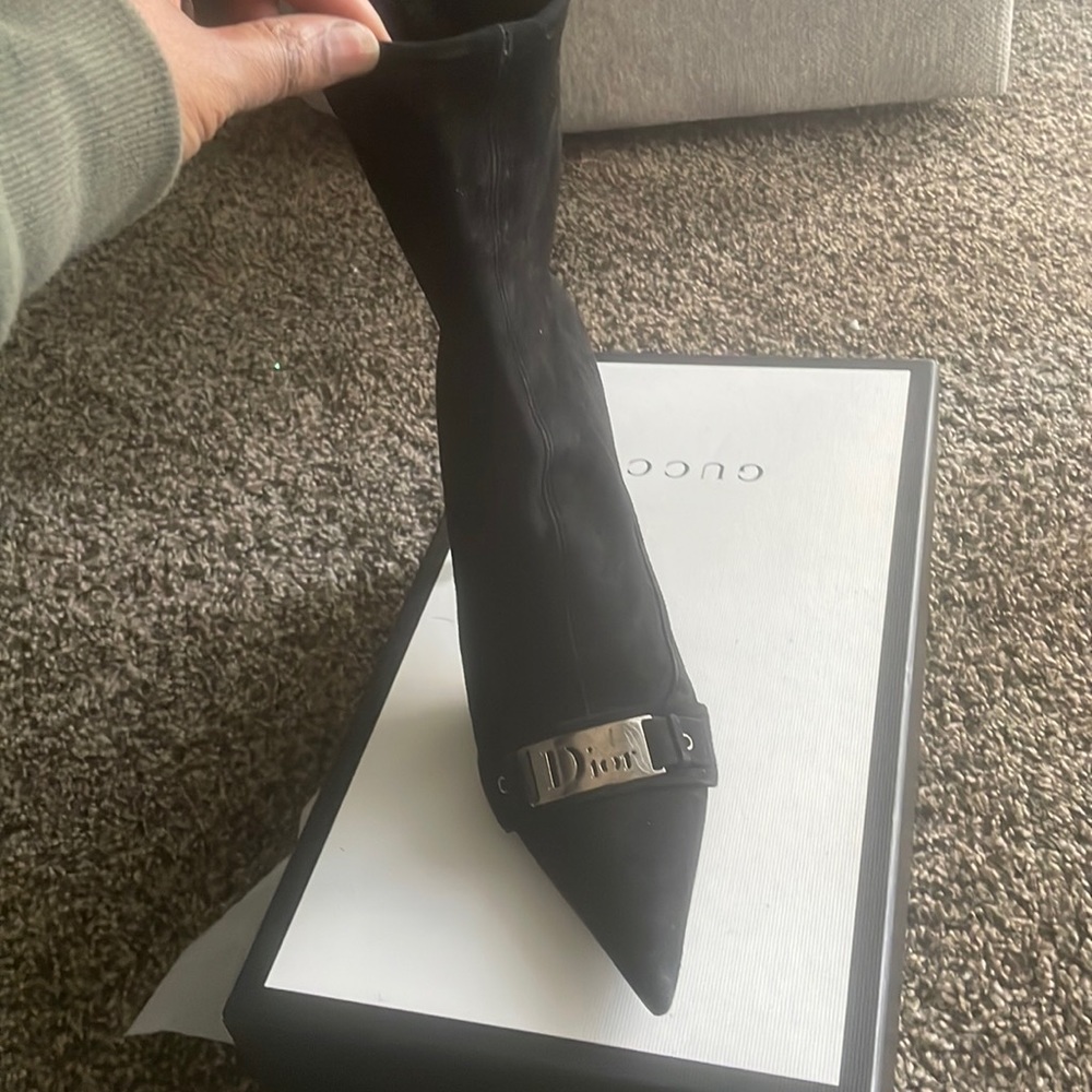 Black Dior bootie with silver Dior hardware .